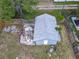 Aerial view of the shed which has a white door and is surrounded by a wooden fence at 1504 Indiana Ave, St Cloud, FL 34769
