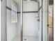 An updated bathroom features white subway tile and a glass door shower with rainfall showerhead at 1504 Indiana Ave, St Cloud, FL 34769