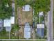 Aerial view of the neighborhood showing surrounding houses and mature trees at 1504 Indiana Ave, St Cloud, FL 34769