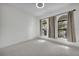 Light-filled bedroom with plush carpeting and elegant arched windows at 1560 Canopy Pasture Dr, St Cloud, FL 34771