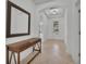 Entryway with tiled flooring and a wooden console table at 1560 Canopy Pasture Dr, St Cloud, FL 34771