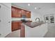 Kitchen with granite countertops, stainless steel appliances, and convenient breakfast bar at 1560 Canopy Pasture Dr, St Cloud, FL 34771