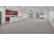 Bright open-concept living room with kitchen bar and French doors to the outdoors at 1560 Canopy Pasture Dr, St Cloud, FL 34771