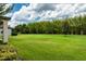 Lush backyard with a thick bamboo perimeter offering privacy, perfect for outdoor enjoyment at 1597 Katie Cv, Sanford, FL 32771