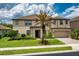 Charming home featuring lush landscaping, well manicured lawn and a two-car garage at 1597 Katie Cv, Sanford, FL 32771