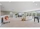 Open-concept living room featuring a TV, sofa, chairs, and a foosball table at 1597 Katie Cv, Sanford, FL 32771