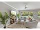 Cozy living room showcasing neutral tones, comfortable seating, and abundant natural light at 1597 Katie Cv, Sanford, FL 32771