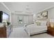 Spacious main bedroom with a tray ceiling, a ceiling fan, and plenty of natural light at 1597 Katie Cv, Sanford, FL 32771