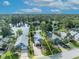 Beautiful aerial view of a well-kept house with a scenic lake view surrounded by trees at 172 Clear Lake Cir, Sanford, FL 32773