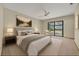 Staged bedroom with new carpet, fan and outside view at 172 Clear Lake Cir, Sanford, FL 32773
