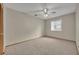 Empty bedroom with neutral colored walls, carpet and window at 172 Clear Lake Cir, Sanford, FL 32773