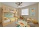 Staged bedroom featuring a bunk bed, colorful rug and toys at 172 Clear Lake Cir, Sanford, FL 32773