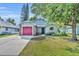 Beautiful one-story home with a pink garage door, lush green lawn, and inviting curb appeal at 172 Clear Lake Cir, Sanford, FL 32773