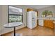 Kitchen with breakfast table features wood cabinets and a large window view at 172 Clear Lake Cir, Sanford, FL 32773