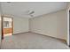 Open living room with neutral colored carpet and view to kitchen at 172 Clear Lake Cir, Sanford, FL 32773