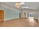 Bright living room with skylights, wood floors, and easy access to outdoor patio at 172 Clear Lake Cir, Sanford, FL 32773