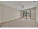 Spacious living room with sliding glass door and ceiling fan at 172 Clear Lake Cir, Sanford, FL 32773