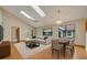 Bright, open-concept living room featuring vaulted ceilings, skylights, and contemporary furnishings at 172 Clear Lake Cir, Sanford, FL 32773