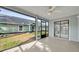 Spacious sunroom with ceiling fan and screened windows at 172 Clear Lake Cir, Sanford, FL 32773