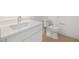 Clean, modern bathroom with white countertop, sleek sink faucet, toilet, and light wood flooring at 1760 Mondrian Cir, Winter Park, FL 32789