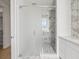 Modern bathroom featuring a glass-enclosed shower, marble accents, and sleek fixtures at 1760 Mondrian Cir, Winter Park, FL 32789