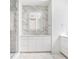 Bathroom with marble walls, shower, and vanity at 1760 Mondrian Cir, Winter Park, FL 32789