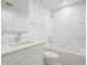 Modern bathroom featuring white tile, a marble vanity, and a shower-tub combo at 1760 Mondrian Cir, Winter Park, FL 32789