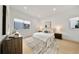 Bright bedroom with wood floors, neutral colors, textured rug, and modern furniture at 1760 Mondrian Cir, Winter Park, FL 32789