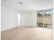 Bright bedroom with light wood floors and a large sliding window at 1760 Mondrian Cir, Winter Park, FL 32789