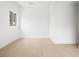 Minimalist bedroom with hardwood floors and natural light through a window at 1760 Mondrian Cir, Winter Park, FL 32789