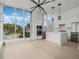 Spacious kitchen with marble countertops, stainless steel appliances, and oversized view-framing window at 1760 Mondrian Cir, Winter Park, FL 32789