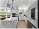 Open concept kitchen with island and eat in seating flows into living space with natural light at 1760 Mondrian Cir, Winter Park, FL 32789