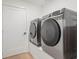 Modern laundry room with stainless steel washer and dryer at 1760 Mondrian Cir, Winter Park, FL 32789