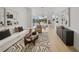 Open-concept living space with designer rug, modern furniture, and lots of natural light at 1760 Mondrian Cir, Winter Park, FL 32789