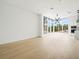 Open-concept living area with large windows and modern light fixture at 1760 Mondrian Cir, Winter Park, FL 32789