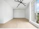 Bright, airy living room features modern light fixture and large windows at 1760 Mondrian Cir, Winter Park, FL 32789