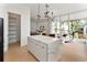 Open floorplan features a kitchen island flowing into the living area with lots of natural light at 1760 Mondrian Cir, Winter Park, FL 32789