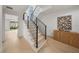 Modern staircase with black railing, hardwood floors, and stylish decor at 1760 Mondrian Cir, Winter Park, FL 32789