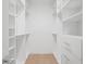 Spacious walk-in closet featuring ample shelving and storage, offering organization and convenience at 1760 Mondrian Cir, Winter Park, FL 32789