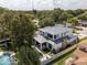 Aerial view of home highlighting the pool, outdoor living space, and backyard at 1781 Pine Ave, Winter Park, FL 32789