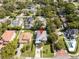 Aerial view of home in a neighborhood with mature trees, lush landscaping, and well manicured lawns at 1781 Pine Ave, Winter Park, FL 32789