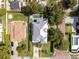 Aerial view of home featuring a backyard pool, mature landscaping, and a well-manicured lawn at 1781 Pine Ave, Winter Park, FL 32789