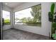 Spacious balcony with tiled floors and expansive views of surrounding trees and rooftops at 1781 Pine Ave, Winter Park, FL 32789