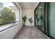 Outdoor balcony with tiled flooring, sliding glass doors, and minimalist decor at 1781 Pine Ave, Winter Park, FL 32789