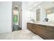 Bathroom boasting a double vanity, modern fixtures, and marble flooring at 1781 Pine Ave, Winter Park, FL 32789