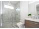 Modern bathroom featuring a glass shower, sleek vanity, and stylish marble-look tiling for a luxurious feel at 1781 Pine Ave, Winter Park, FL 32789