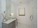 Bright bathroom featuring a modern vanity, glass shower, and a window for natural light at 1781 Pine Ave, Winter Park, FL 32789