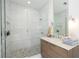 Modern bathroom featuring a glass shower, vanity with sleek fixtures, and stylish tile work at 1781 Pine Ave, Winter Park, FL 32789