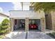 Open garage showcasing a red sports car and ample storage space, with a stone exterior at 1781 Pine Ave, Winter Park, FL 32789