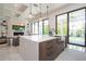 Modern kitchen featuring an island with white countertops, wood cabinets, and stainless steel sink at 1781 Pine Ave, Winter Park, FL 32789